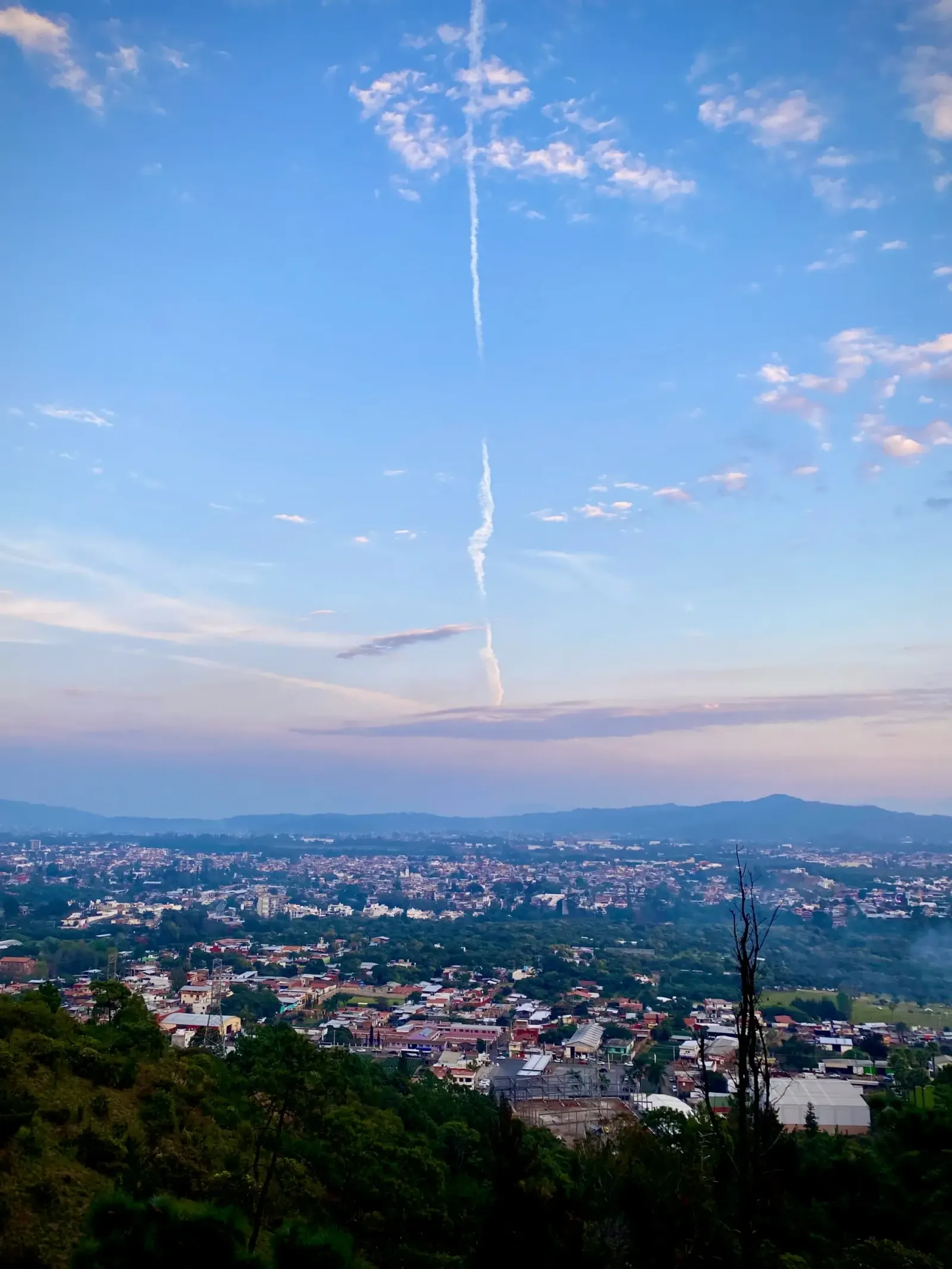 Vapor Trail Over Town